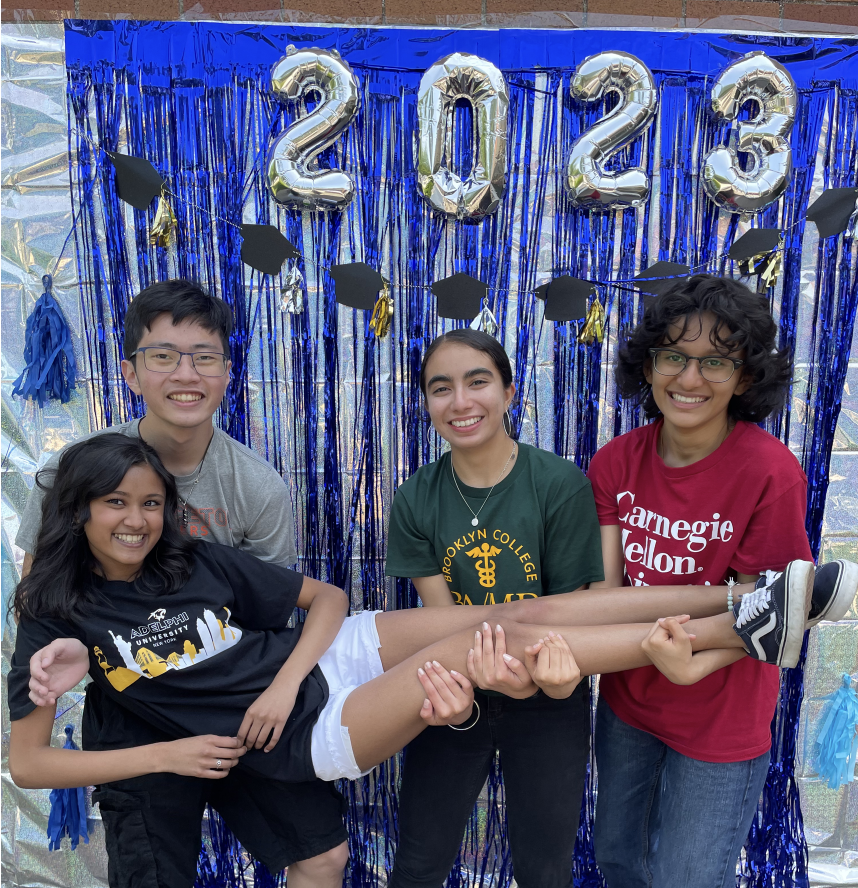 Seniors Paul Wang, Alyssa Hardeen, Kushpreet Ahuja and Helee Shukla pose in front of the photo booth set up by the guidance department. (Source from Helee Shukla)